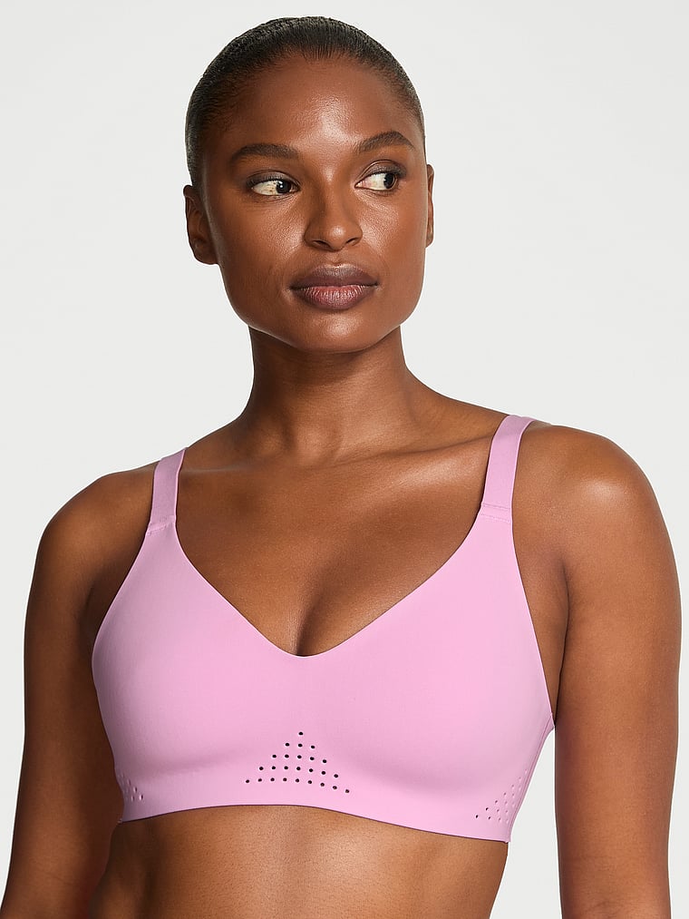 Victoria's Secret, VSX VSX Featherweight™ Medium V-Neck Sports Bra, Bikini Pink, onModelFront, 1 of 2 Tsheca  is 5'9" or 175cm and wears 34B or Small