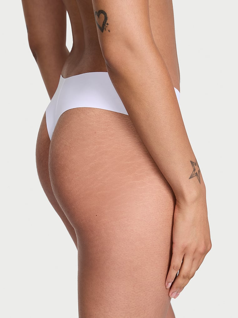 Victoria's Secret, No-Show No-Show Thong Panty, VS White, onModelBack, 2 of 3 Anisha is 5'11" and wears Small