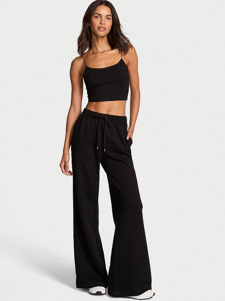 Victoria's Secret, Angel Essentials Effortless Fleece Wide-Leg Sweatpant, Pure Black, onModelFront, 1 of 4 Daiane is 5'11" or 180cm and wears Small