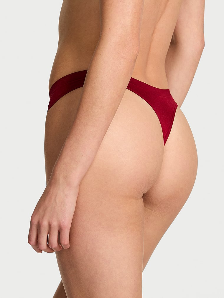 Victoria's Secret, Seamless Seamless Shine Thong Panty, Red Lacquer, onModelBack, 2 of 3 Aga is 5'10" or 178cm and wears Small