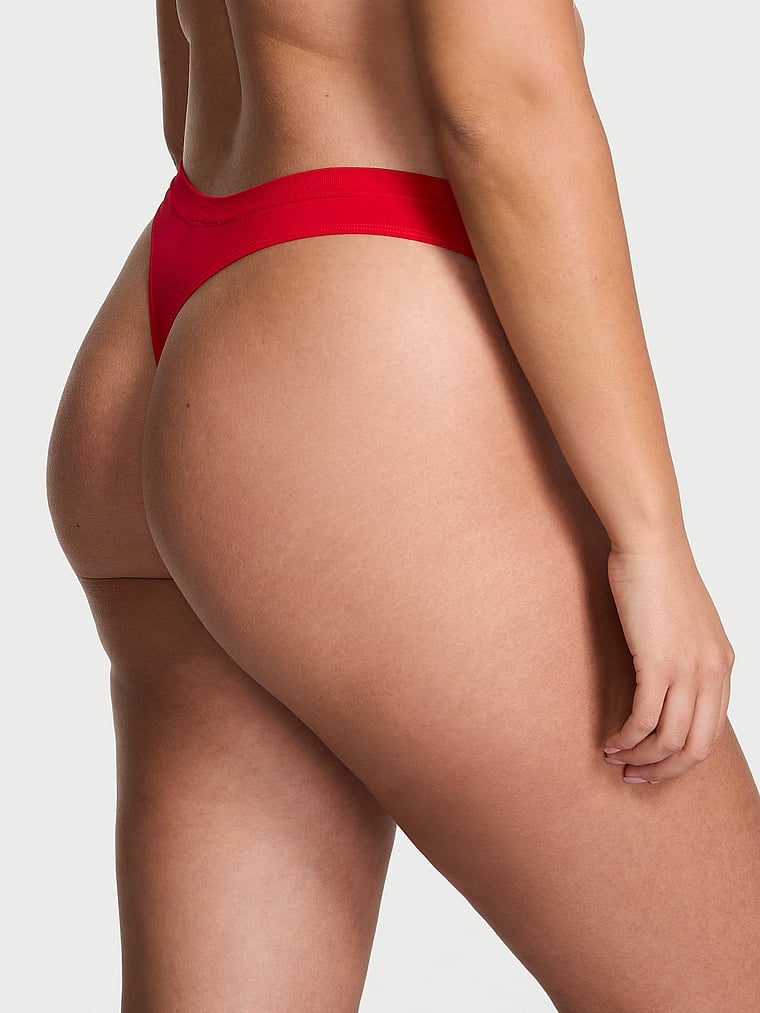 Victoria's Secret, Seamless Seamless Bow Thong Panty, Bright Vermillion, onModelBack, 1 of 3 Karmi is 5'10" or 178cm and wears Large