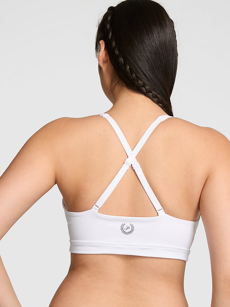 PINK Relay Criss-Cross Plunge Sports Bra, Vs White, onModelBack, 2 of 3 Gloria is 5'9" and wears 34D or Small