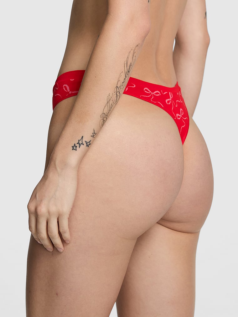 PINK Seamless High-Leg Thong Panty, Bright Vermillion Bow Print, onModelBack, 2 of 3 Sofia is 5'10" and wears Small