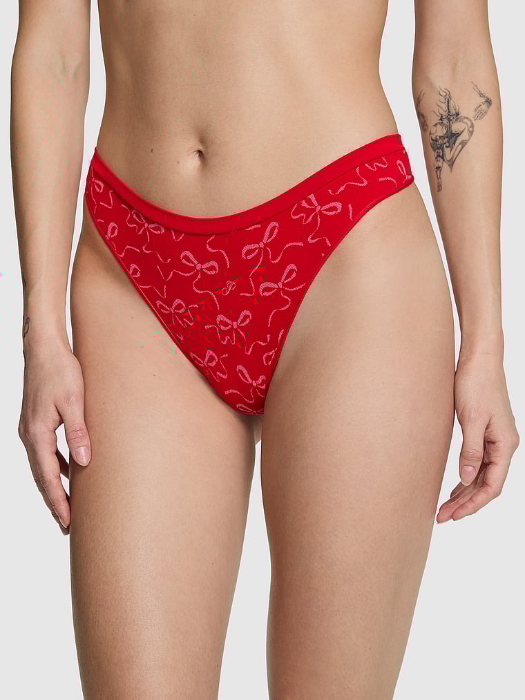 PINK Seamless High-Leg Thong Panty, Bright Vermillion Bow Print, onModelFront, 1 of 3 Sofia is 5'10" and wears Small