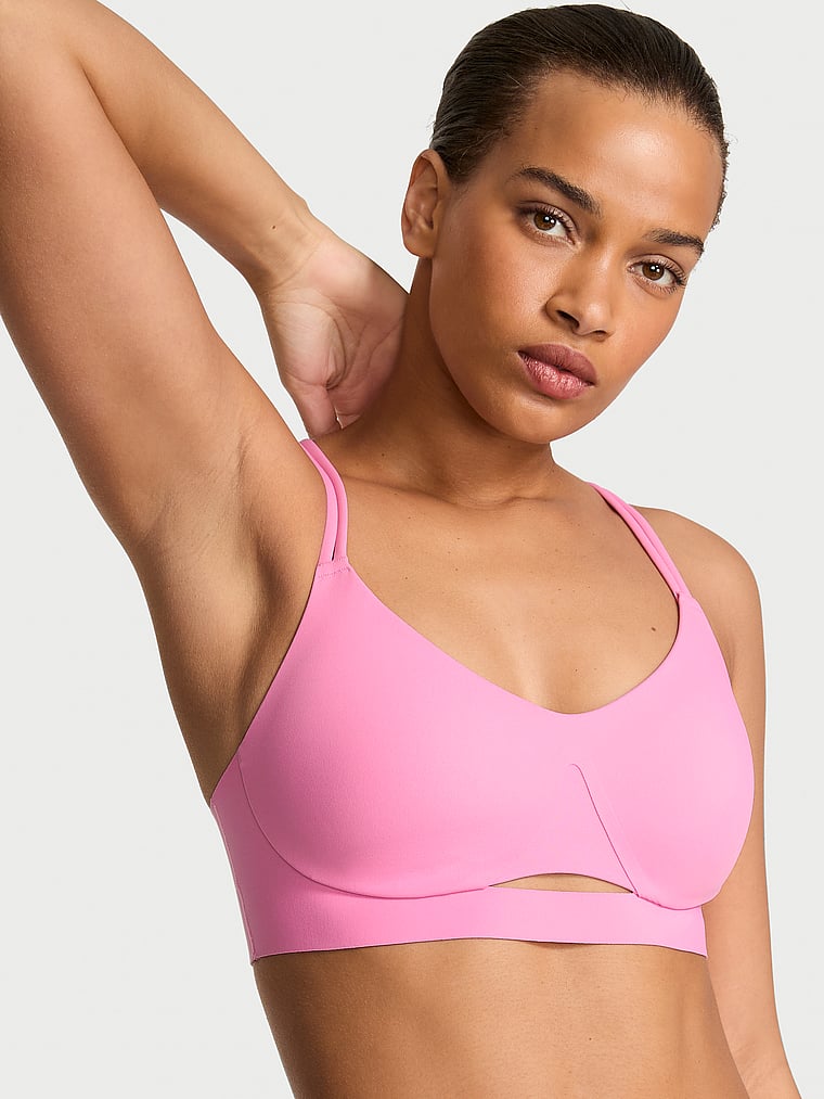 Victoria's Secret, VSX VSX Elevate™ Strappy-Comfort Sports Bra , Pink Sugar, onModelSide, 4 of 4 Nisaa is 5'9" and wears 34B or Small