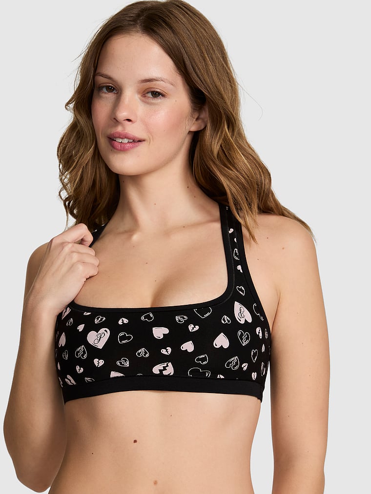 PINK Cotton Dorm Unlined Racerback Bralette, Black Heart Breaker Print, onModelFront, 1 of 3 Taylor is 5'8" and wears 32B or Small