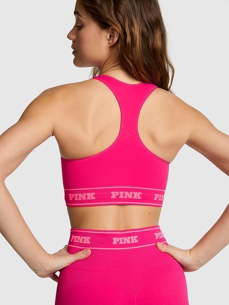 PINK Seamless Reversible Sports Bra, Hot Stuff, onModelBack, 2 of 3 Ruby is 5'6" and wears 32A or Small