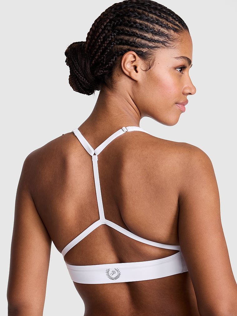 PINK PINK Relay™ Scoop T-Back Sports Bra, White, onModelFront, 1 of 3