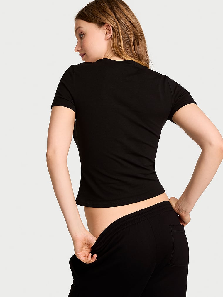 Victoria's Secret, Angel Essentials Stretch Cotton Fitted Tee, Black Graphic, onModelBack, 2 of 3 Lotta is 5'10" or 178cm and wears Small