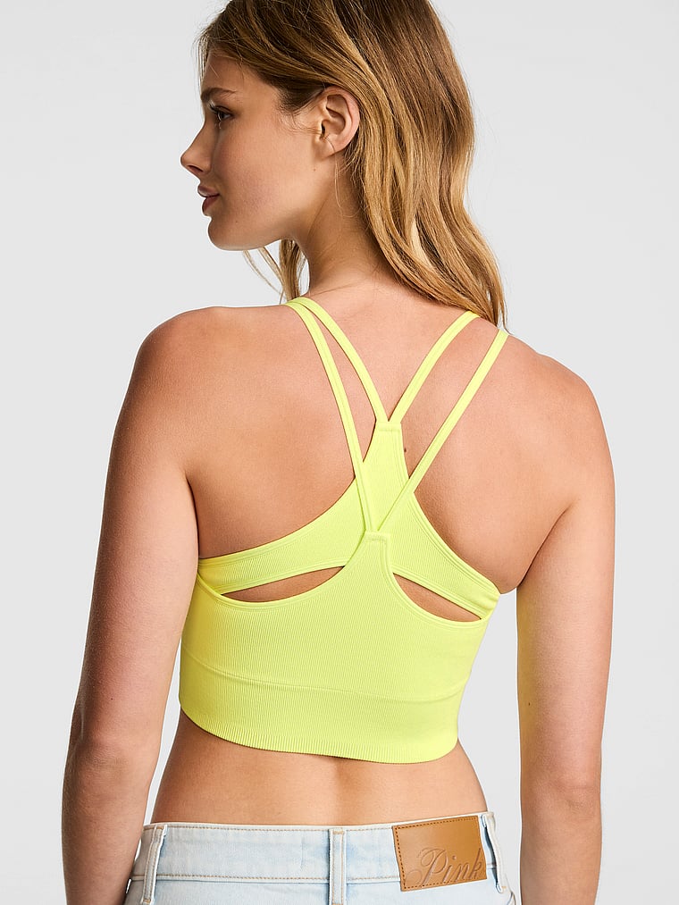 PINK Soft Seamless Strappy Sports Bra, Lime Citron, onModelFront, 1 of 3 Mari is 5'7" and wears 34B or Small