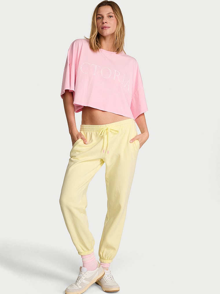 Victoria's Secret, Angel Essentials Iconic Fleece Relaxed Jogger Sweatpant, Lemonade, onModelFront, 1 of 3 Aga is 5'10" and wears Small