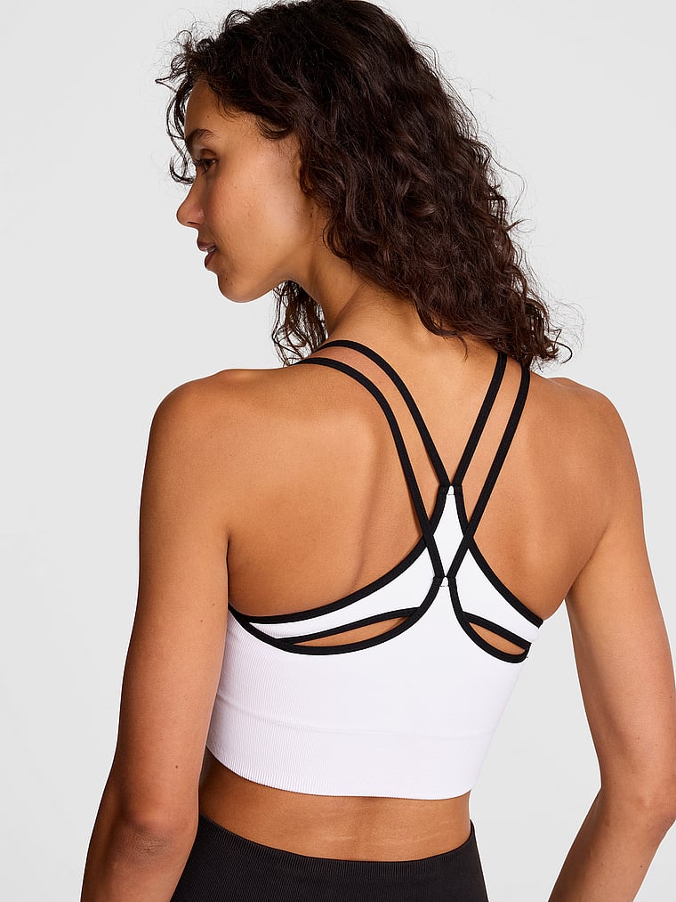 PINK Soft Seamless Strappy Sports Bra, White, onModelFront, 1 of 3 Rae is 5'10" and wears 34B or Small