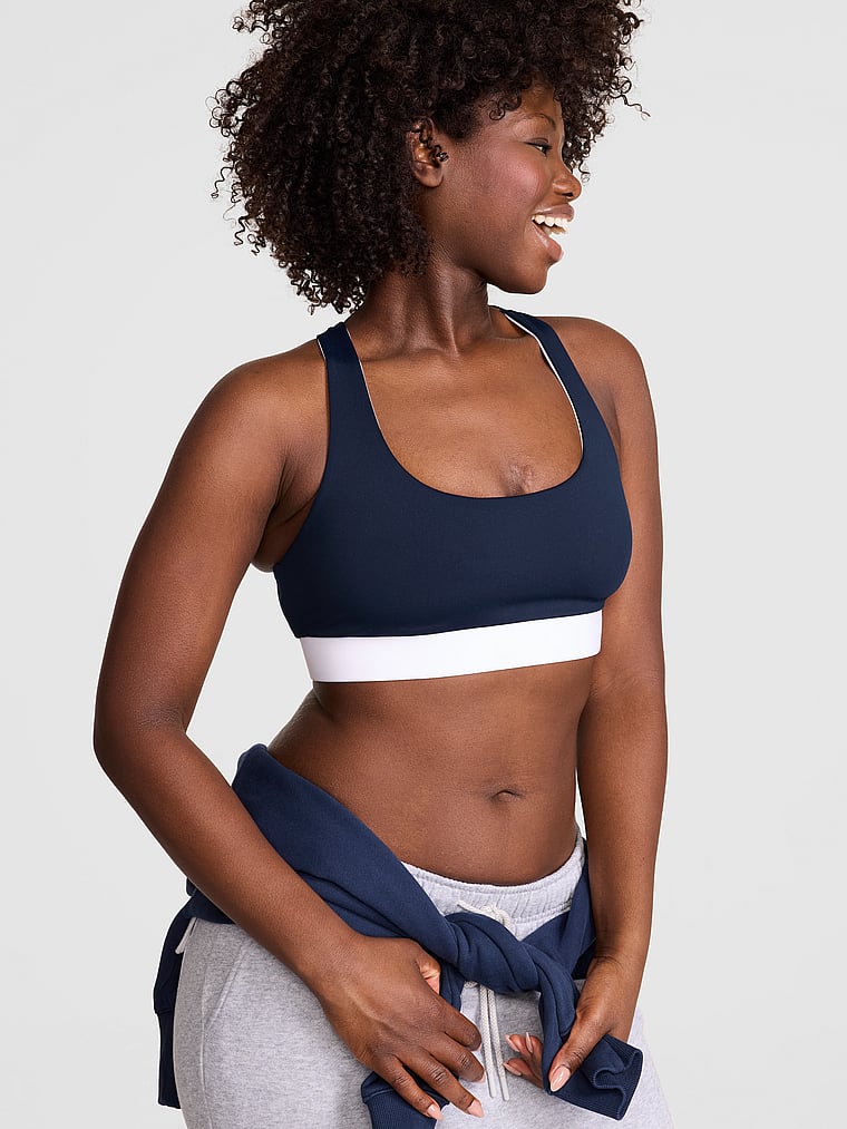 PINK PINK Relay™ Racerback Sports Bra, Noir Navy, onModelFront, 1 of 3 Fanta is 5'11" and wears 34D or Medium