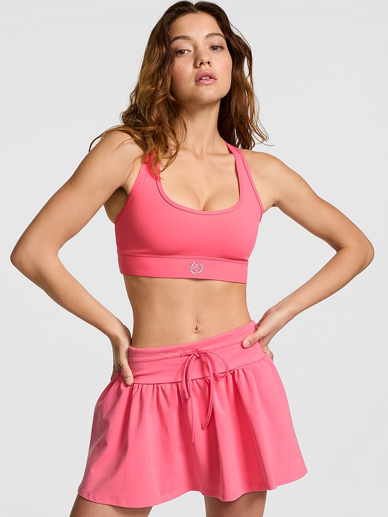 PINK PINK Relay™ Racerback Sports Bra, Vivid Pink, onModelFront, 1 of 3 Ruby is 5'6" and wears 32A or Small