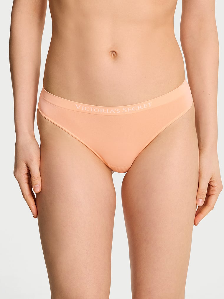 Victoria's Secret, Seamless Seamless Thong Panty, Sunlit Apricot, onModelFront, 1 of 3 Lotta is 5'10" and wears Small