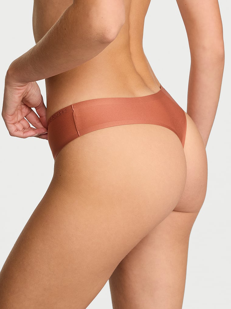 Victoria's Secret, Body by Victoria Body by Victoria Flex Shadow Stripe Mid-Rise Thong Panty, Copper Brown, onModelBack, 2 of 2 Ari is 5'9" and wears Small