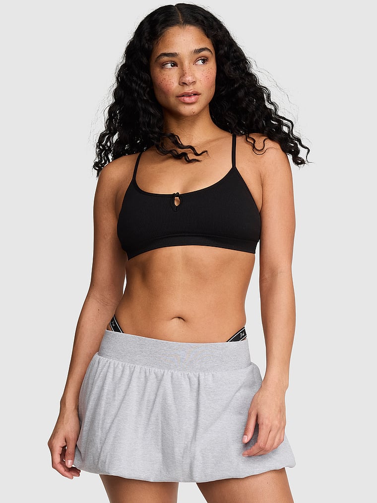 PINK AnyWear Low-Scoop Racerback Bra, Black, onModelFront, 1 of 3