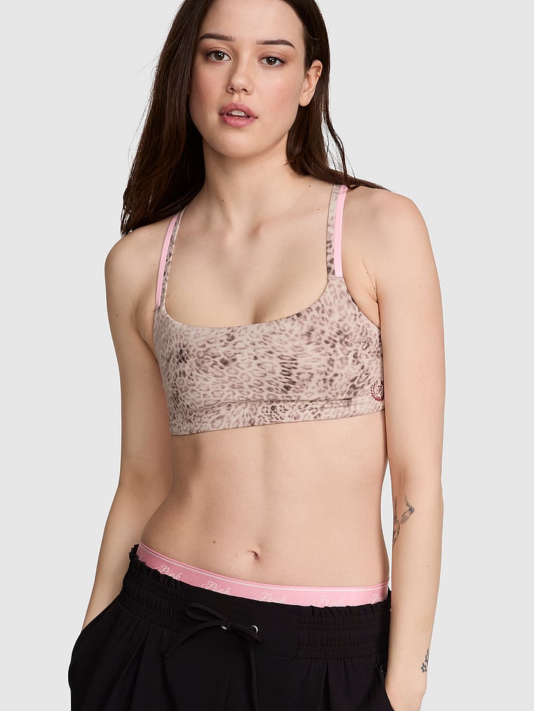 PINK Relay Square-Neck Sports Bra, Leopard, onModelFront, 1 of 4 Sofia is 5'10" and wears 34B or Small