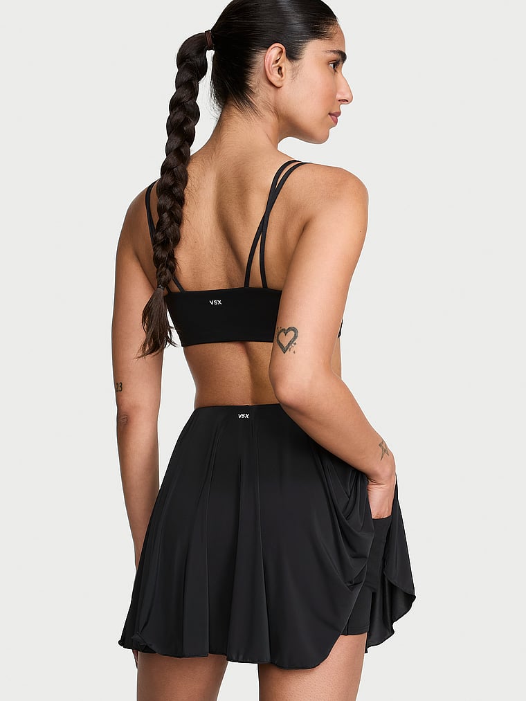 Victoria's Secret, VSX VSX Elevate™ Sheer Radiance Active Skirt, Black, onModelBack, 2 of 3 Anisha is 5'11" or 180cm and wears Small