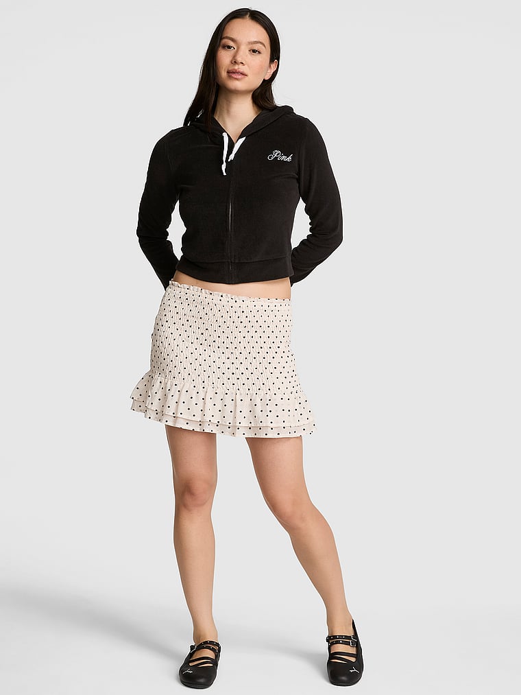 PINK Flirty Fit Smocked Mini Skirt, White Dot, onModelFront, 1 of 4