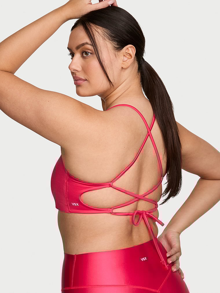 Victoria's Secret, VSX VSX GlossyTech™ Strappy-Back Sports Bra, Pink Island, onModelSide, 3 of 6