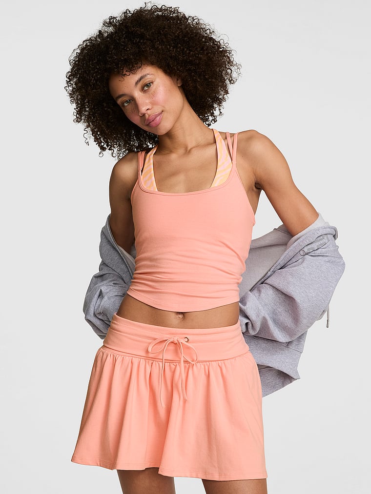 PINK All-Day Cotton™ Foldover Flirty Mini Skort, Neon Apricot, onModelFront, 1 of 3 Drew is 5'9" or 175cm and wears Small