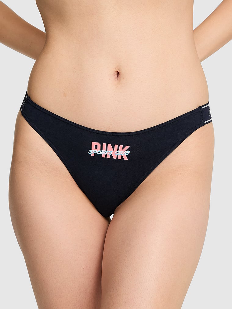 PINK Logo Cotton Scoop Thong Panty, Noir Navy With Pink Sport Club Graphic, onModelFront, 1 of 3