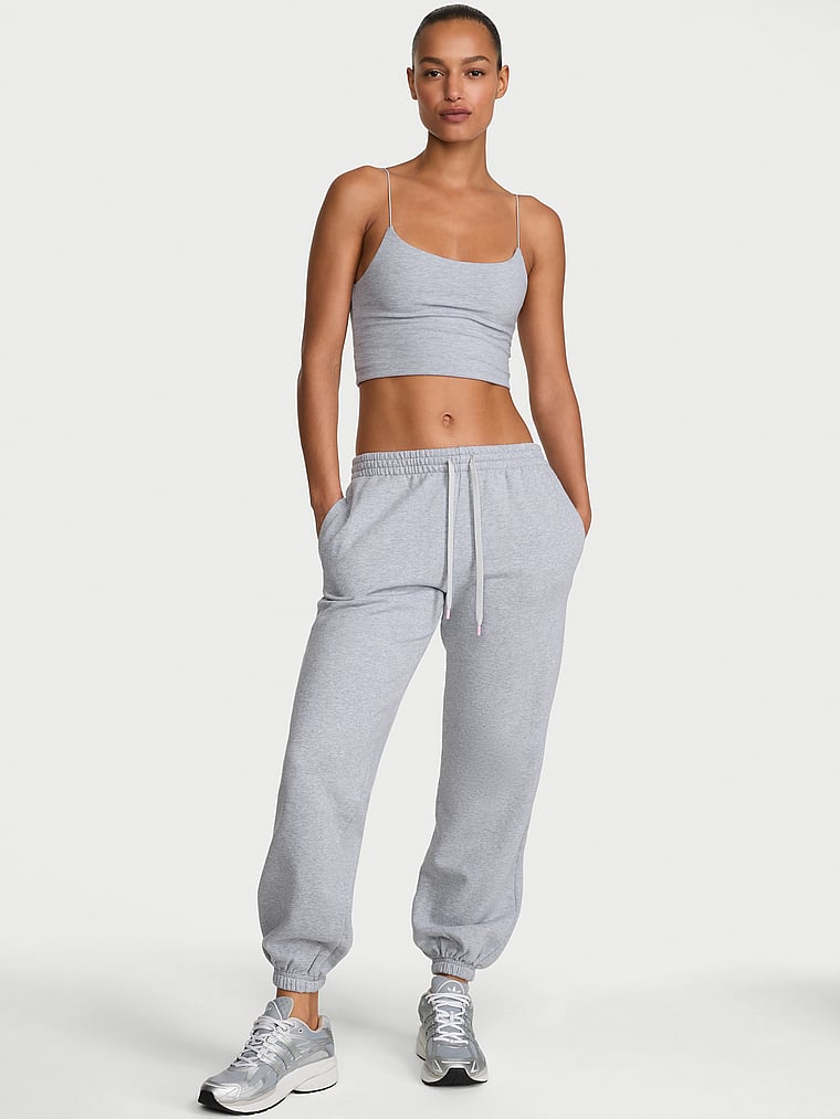 Victoria's Secret, Angel Essentials Iconic Fleece Relaxed Jogger Sweatpant, Medium Heather Grey, onModelFront, 1 of 3 Nikita  is 5'10" or 178cm and wears Small