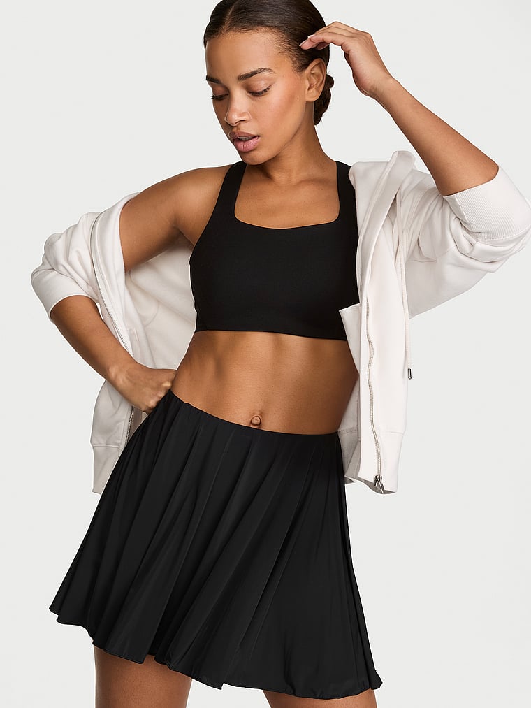 Victoria's Secret, VSX VSX RacketCool™ Racerback Sports Bra, Black & White, onModelFront, 1 of 3 Nisaa is 5'9" or 175cm and wears 34B or Small