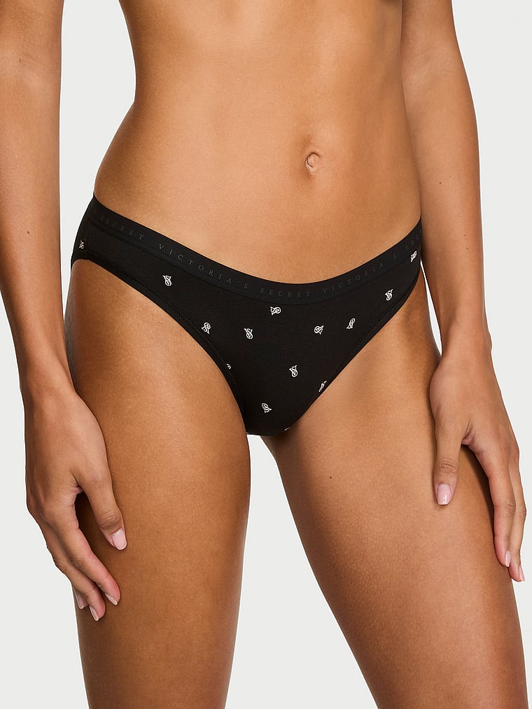 Victoria's Secret, Victoria's Secret Cotton Lace-Trim Bikini Panty, Black Tossed Logos, onModelFront, 1 of 3