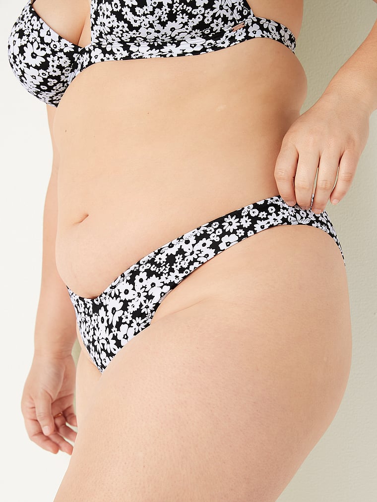 PINK V-Front Itsy Bikini Bottom, Pure Black Daisy, onModelSide, 3 of 5 Anna is 5'8" or 173cm and wears Large