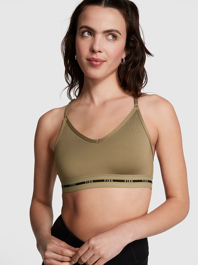 PINK Ultimate Lightly Lined Sports Bra, Dusted Olive, onModelFront, 1 of 3 Scarlett is 5'11" and wears 34B or Small